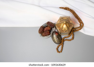 Top View Of Wooden Rosary With Moroccan Ramadan Lantern And Dates, Used For Religious Greeting Card As Hajj, Eid And Ramadan.