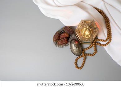 Top View Of Wooden Rosary With Moroccan Ramadan Lantern And Dates, Used For Religious Greeting Card As Hajj, Eid And Ramadan 