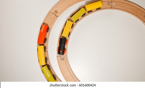 TOP VIEW: Wooden Toy Trains Move On Round Wooden Railways