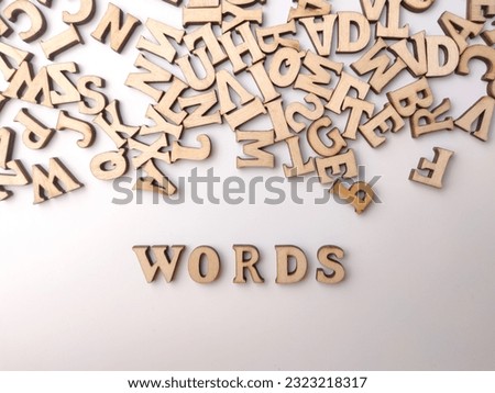 Top view wooden word with the word WORDS on a white background.