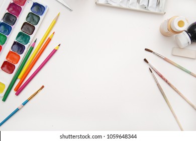 Top view of Work Process Blank Watercolor Paper pad, Watercolor Painting Supplies, Brushes and Colorful Pencil. Creation process of watercolor painting. Copy space. - Powered by Shutterstock