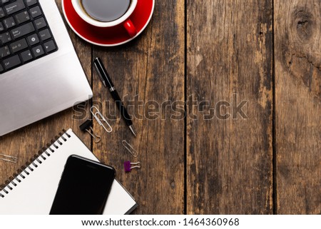 Top View Work space, office desk with computer,smartphone and office supplies
