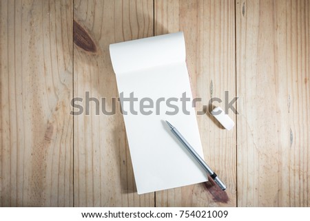 Similar – Yellow notepad with a ballpoint pen