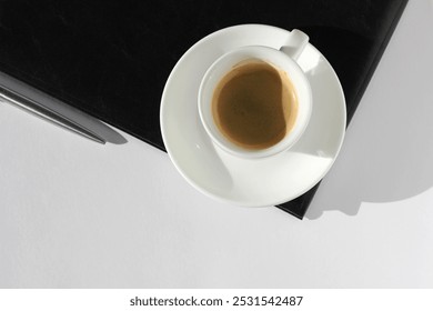 Top View of Workplace Flat lay with Black Notebook, Cup of Espresso, Pen. Professional Business People.