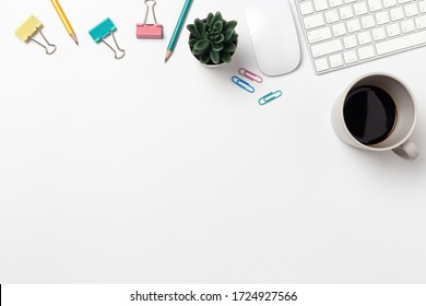 Top view, Workspace desk With coffee and office supplies on white background
