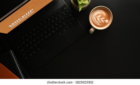 Top view of worktable with mock up tablet, coffee cup and copy space in home office room