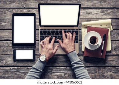 Top view of writer's workplace - laptop and tablet pc with cup of coffee. Clipping paths included.