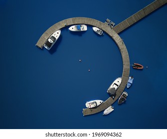 Top view of yacht club. White boats in sea water.  - Powered by Shutterstock