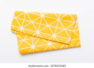 top view with yellow empty kitchen napkin isolated on table background. Folded cloth for mockup with copy space, Flat lay. Minimal style. - Powered by Shutterstock