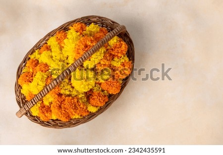 Top view of yellow orange flowers with basket, Onam flower background