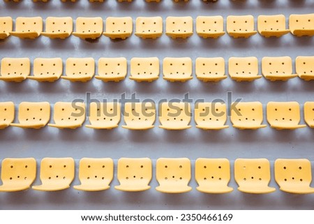 Top view of yellow seats on sport stadium with the chairs are lined up
