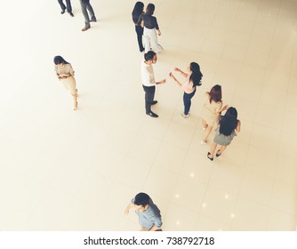 Top View Of Young Business People Walking And Standing Separate Discussion Meeting On Pathway Before Starting Work In Their Office .Business Communication Lifestyle Concept