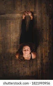 Top View Of Young Calm Women Do Complex Of Stretching Yoga Asanas In Loft Style Class. Urdhva Mukha Svanasana - Upward-Facing Dog Pose