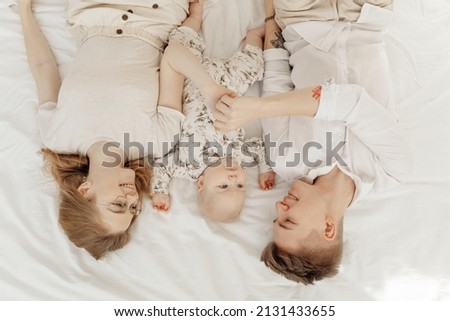 Similar – Top view of happy children having breakfast in the bed with their mother in a relaxed morning