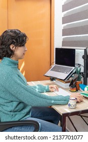 Top View Of Young Latina Woman Working At Her Desk At Home With Her Computer. Home Office Concept.