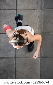 Top View Of Young Woman Wear Sport Shoes Running On Pavement