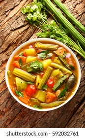 Top View-Famous South Indian Sambar Dish Served On A Wooden Table.