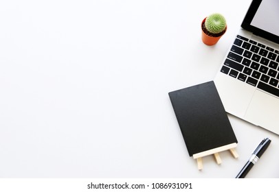 Top view,Flat lay workspace with mock up Notebook and Laptop on the desk copy space for your text.