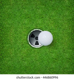 Top Views Of Golf Ball And Golf Hole On Green Grass Texture.