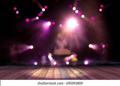 top wood desk with light bokeh in concert blur background,wooden table