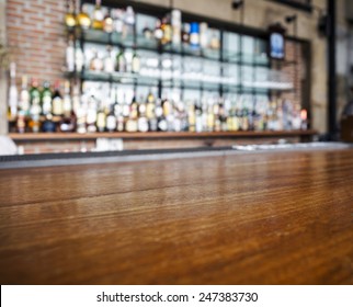 Top Wooden Table With Bar Blurred Background