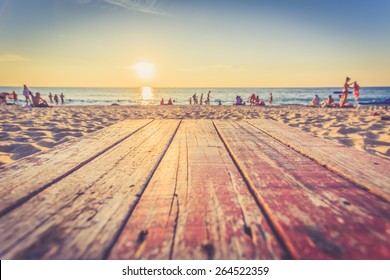 Top of wooden table at sunset beach in Thailand, Vintage filter effect - Powered by Shutterstock