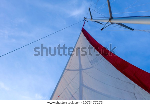 The top of yacht sailing in Andaman sea,\
beautiful and bright blue sky in the\
morning.