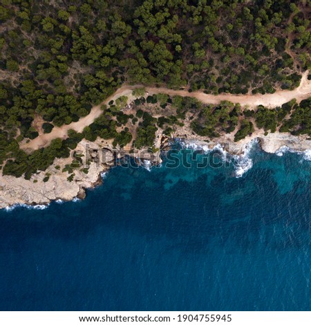 Top-down aerial shot of Mediterranean coast line on the island of Mallorca, Spain