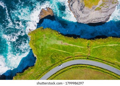 Top-down aerial view over the Irish rugged coastline at Kilkee Cliffs, Co Clare. Epic Irish  Seascape along the wild Atlantic way.The natural beauty of the cliff edge and the blue Atlantic ocean. - Powered by Shutterstock