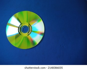 Top-down Closeup View Of Cd Dvd On Blue Background Early 2000s Style