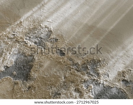 Top-down drone shot capturing the effects of soil erosion. The damaged, rugged terrain contrasts with the linear patterns of the adjacent farmland, creating a powerful visual.