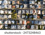 Top-down drone shot capturing the urban pattern of city streets and buildings at dusk. Limassol, Cyprus