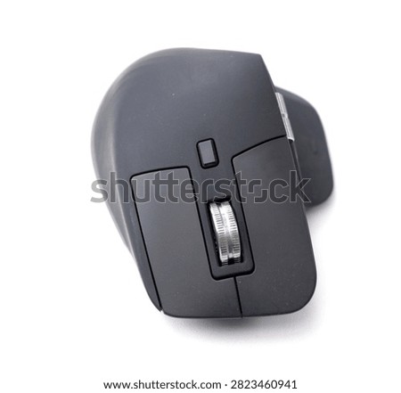 A topdown studio shot of a modern ergonomic black wireless computer mouse isolated on a white background