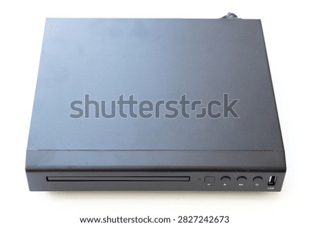 A topdown view of a black compact disc player isolated on a white background