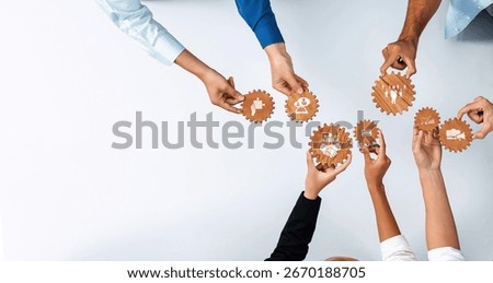 A top-down view of diverse hands collaboratively holding gears, symbolizing teamwork, strategy, and innovation in a professional environment. Perfect for business concepts. Amity
