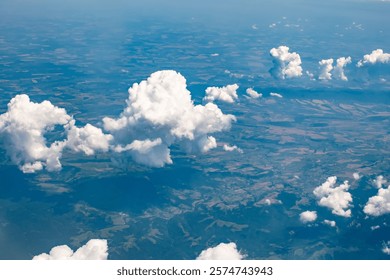 Top-down view of the earth through the clouds.