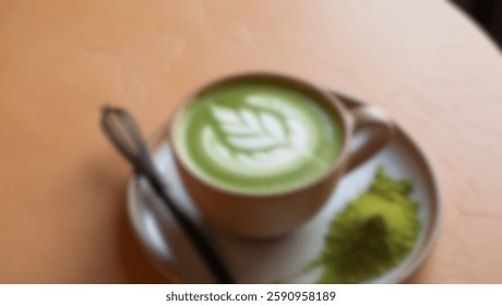 Top-down view of a matcha latte with elegant latte art, served in a rustic ceramic cup. Blurred image, ideal for design and cafe branding.