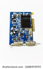 A top-down view of a personal computer graphics card, isolated on a white background. Features a blue PCB, black heatsink, electronic components, and dual DVI ports.

