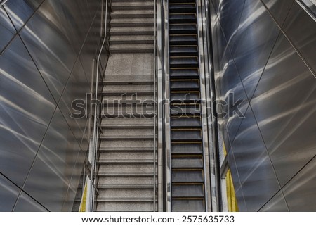 down Symmetry Escalator