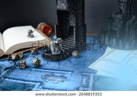 Top-down view of a tabletop RPG setup with dice, miniatures, character sheets, a dice tower, and a fantasy map. Perfect for DnD, strategy games, or role-playing visuals.	

