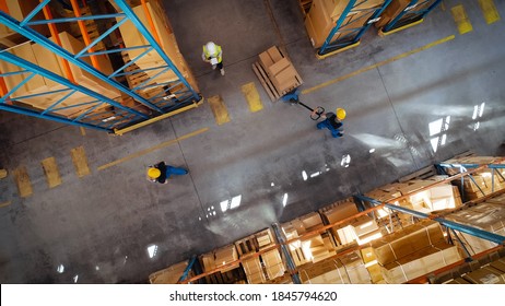 Top-Down View: In Warehouse People Working, Forklift Truck Operator Lifts Pallet with Cardboard Box. Logistics, Distribution Center with Products Ready for Global Shipment, Customer Delivery - Shutterstock ID 1845794620