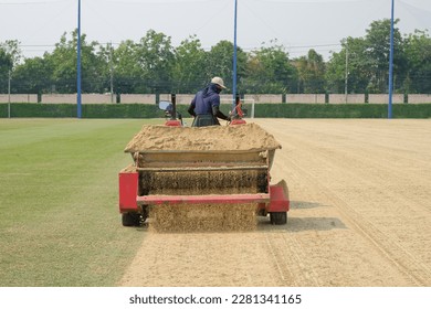 Topdressing a lawn is the process of adding a thin layer of material over the grass.Sand topdressing