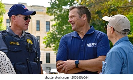 Topeka, Kansas, August 28, 2021
Former Kansas Secretary Of State Kris Kobach And Shawnee County Sheriff Brian Hill Speak With Elected Kansas State Representatives During The Patriots Freedom Rally