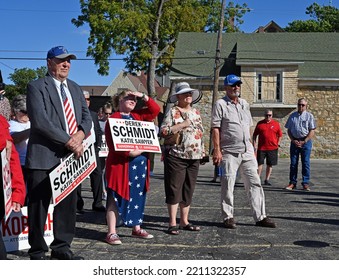 TOPEKA, KANSAS, USA - OCTOBER 5, 2022
Some Of The Crowd Of Supporters Holding Derek Schmidt Yard Signs Listen To The Politicians Speeches At The KSGOP Tour Bus Kickoff 