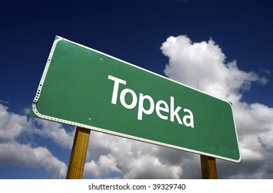 Topeka Road Sign with dramatic blue sky and clouds - U.S. State Capitals Series.
