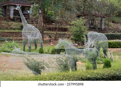 Topiary Plant Pot Wire Animal Shape In Garden