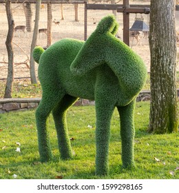 Topiary sculpture of a deer made of artificial grass