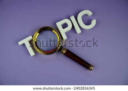 Topic alphabet letters with magnifying glass, business and education concept background