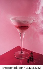 Topical Coktail With Berrieson Vivid Pink Background. Creative Minimal Summer Concept. High Quality Photo