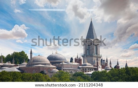Topkapi Palace -Trail of white smoke from the airplane in the cloudy sky - Istanbul, Turkey